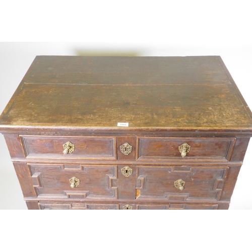 1126 - A late C17th/early C18th oak garret chest of four drawers, raised on bun feet, with adaptions, 95 x ... 