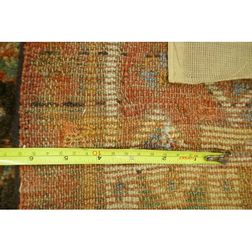 1129 - A multi colour ground Kurdish Kazak wool runner with a geometric medallion design on a brown field, ... 