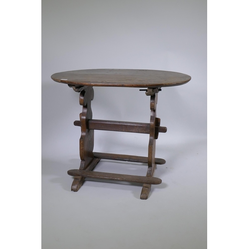 1133 - A C19th French oak trestle table, 66 x 90cm, 72cm high