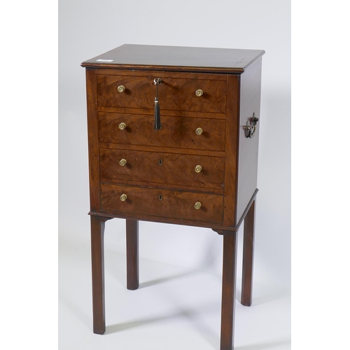 1144 - A George III mahogany cellarette, with four false drawers and lift up top revealing a sectioned inte... 