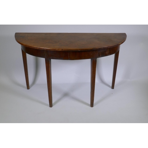 1146 - A C19th mahogany demi lune side table on square tapering supports, 122 x 46cm, 72cm high