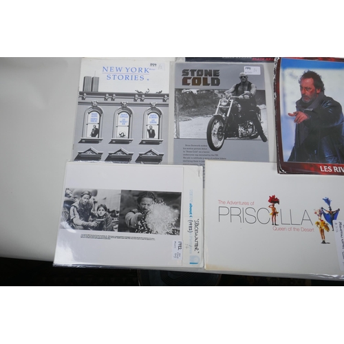 117 - A quantity of lobby cards and film brochures, to include Spacehunter, Rising Sun, White Hunter Black... 