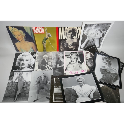 118 - A quantity of Marilyn Monroe ephemera to include press photographs, lobby cards, posters, cuttings, ... 