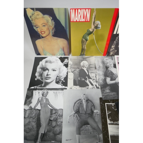 118 - A quantity of Marilyn Monroe ephemera to include press photographs, lobby cards, posters, cuttings, ... 