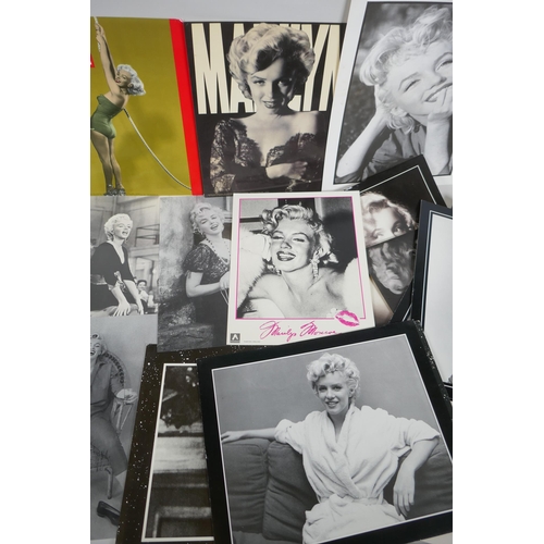 118 - A quantity of Marilyn Monroe ephemera to include press photographs, lobby cards, posters, cuttings, ... 