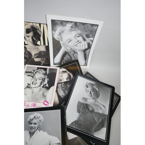 118 - A quantity of Marilyn Monroe ephemera to include press photographs, lobby cards, posters, cuttings, ... 