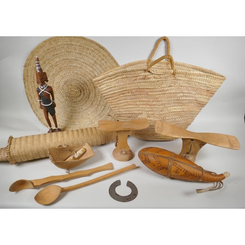 124 - A quantity of Kenyan tribal items to include carved wood head rests, gourd flask, woven baskets etc