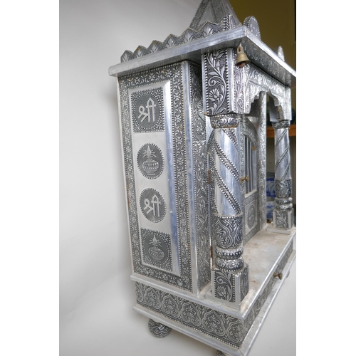 127 - An Indian white metal veneered wooden table top shrine, 46 x 26cm, 82cm high