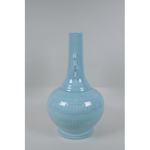 130 - A Chinese celadon glazed porcelain bottle vase with two handles and underglaze archaic style decorat... 