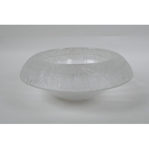 137 - A vintage heavy glass ice bowl with a classical design to the rim, 27cm diameter