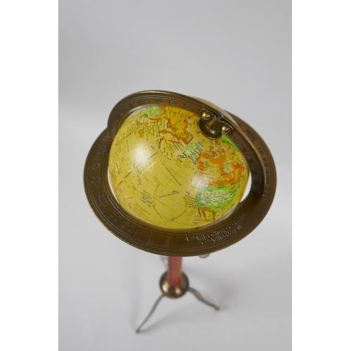 147 - A brass desk top terrestrial globe, 40cm high