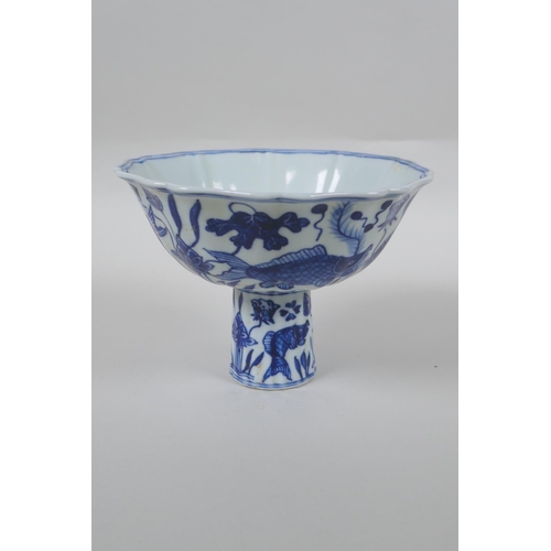 148 - A Chinese blue and white porcelain stem bowl of lobed form decorated with carp in a lotus pond, Xuan... 