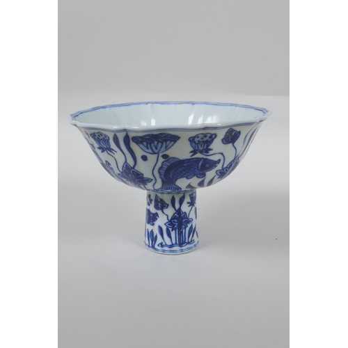 148 - A Chinese blue and white porcelain stem bowl of lobed form decorated with carp in a lotus pond, Xuan... 