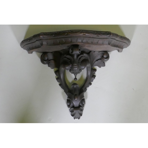 15 - A C19th carved walnut wall bracket, 40cm wide, 29cm high