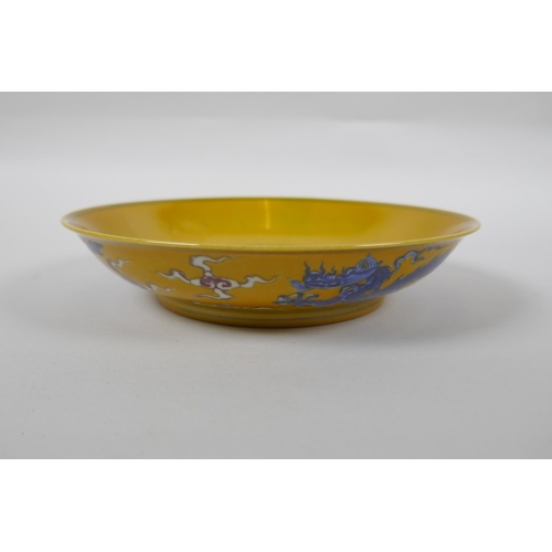 153 - A yellow ground porcelain dish with blue and red dragon decoration, Chinese Chenghua 6 character mar... 