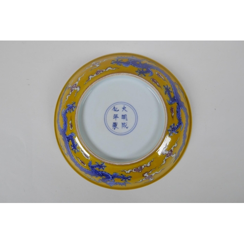 153 - A yellow ground porcelain dish with blue and red dragon decoration, Chinese Chenghua 6 character mar... 