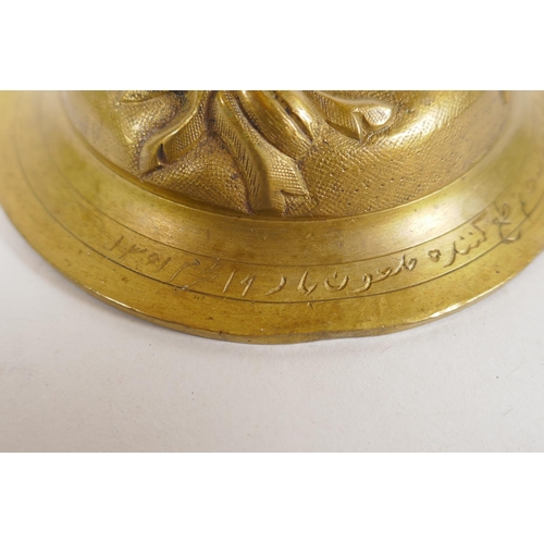 154 - An unusual brass candlestick with Arabic inscription to the base and raised insect decoration, 16cm ... 