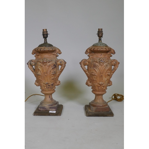 16 - A pair of vintage terracotta urn table lamps, with brass mounts, 51cm high