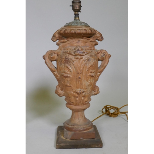 16 - A pair of vintage terracotta urn table lamps, with brass mounts, 51cm high