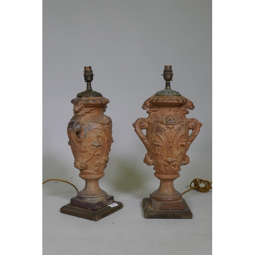 16 - A pair of vintage terracotta urn table lamps, with brass mounts, 51cm high