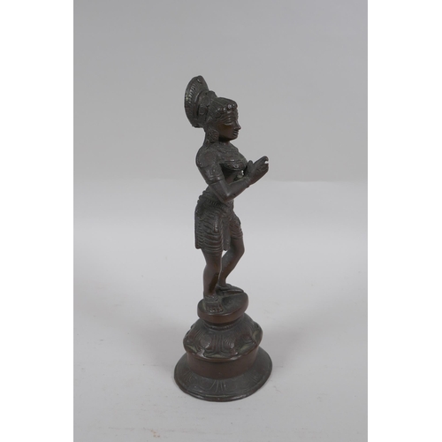 169 - An Indian bronze figure of a woman dancing, 22cm high