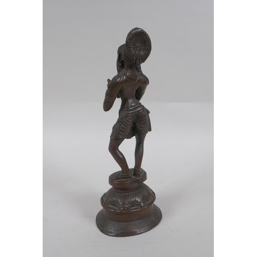 169 - An Indian bronze figure of a woman dancing, 22cm high