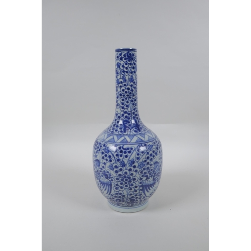 173 - A Chinese blue and white porcelain bottle vase with phoenix decoration, mark to base, 29cm high