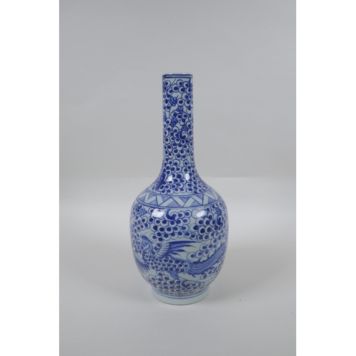 173 - A Chinese blue and white porcelain bottle vase with phoenix decoration, mark to base, 29cm high