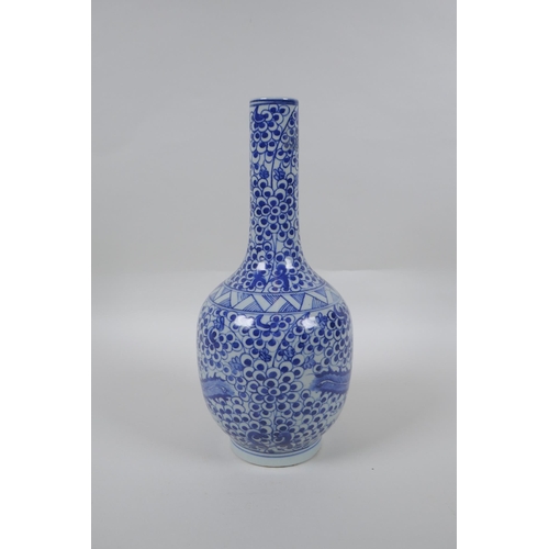 173 - A Chinese blue and white porcelain bottle vase with phoenix decoration, mark to base, 29cm high