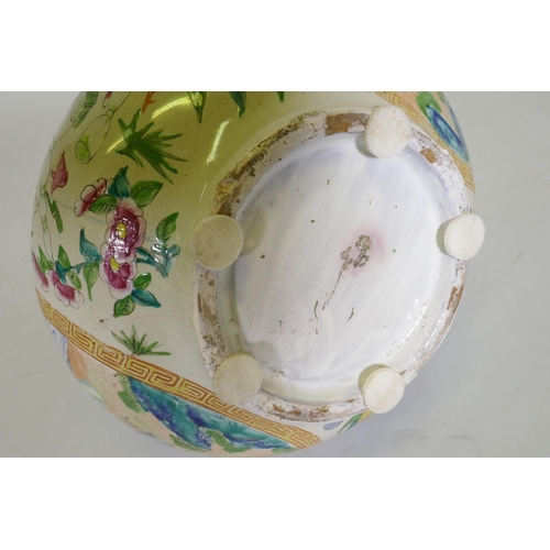 176 - A Cantonese ceramic vase with famille rose decoration, drilled to side, chip to rim, probably early ... 