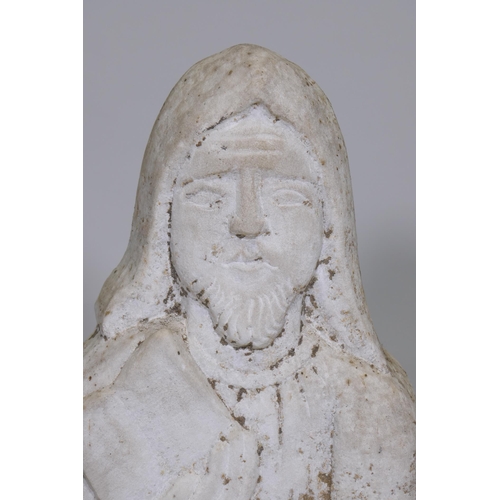 177 - An antique carved weathered marble flat back figure of a barefoot monk holding a book, 50cm high