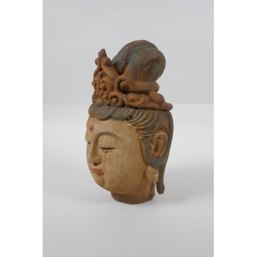 178 - A Chinese carved, painted and distressed wood Quan Yin bust, 22cm high