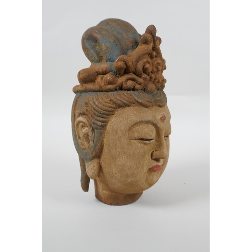 178 - A Chinese carved, painted and distressed wood Quan Yin bust, 22cm high