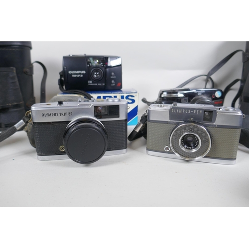 182 - A collection of cameras and equipment, to include an Olympus PEN-EE, an Olympus Trip 35, an Olympus ... 