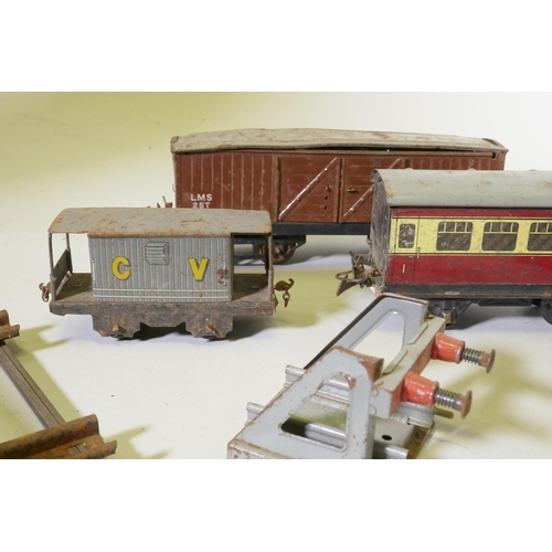 185 - A vintage Hornby, Meccano Ltd O Gauge clockwork railway set, with two type 30 and one type 40 locomo... 