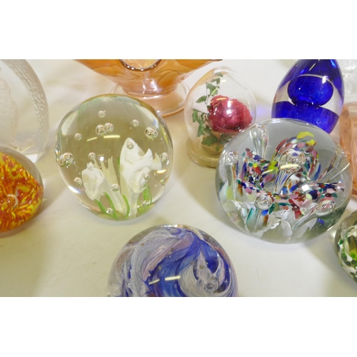 186 - A collection of glass paperweights, including a Charles Sorrel Studio, carnival glass bowl, dressing... 