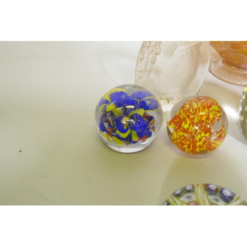 186 - A collection of glass paperweights, including a Charles Sorrel Studio, carnival glass bowl, dressing... 