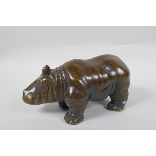 190 - A filled bronze figure of a hippopotamus, 21cm long