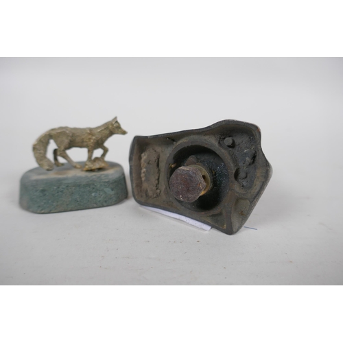 192 - A Desmo chrome metal car mascot in the form of an Airdale terrier, 7.5cm high, and a white metal fox... 