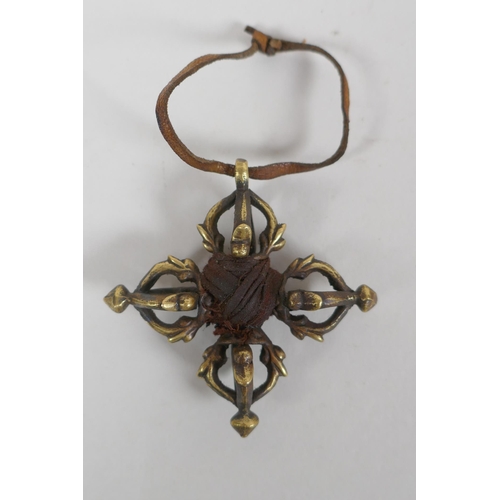 198 - A small Tibetan bronze double vajra pendant and a similar sized vajra pendant, 6 x 6cm