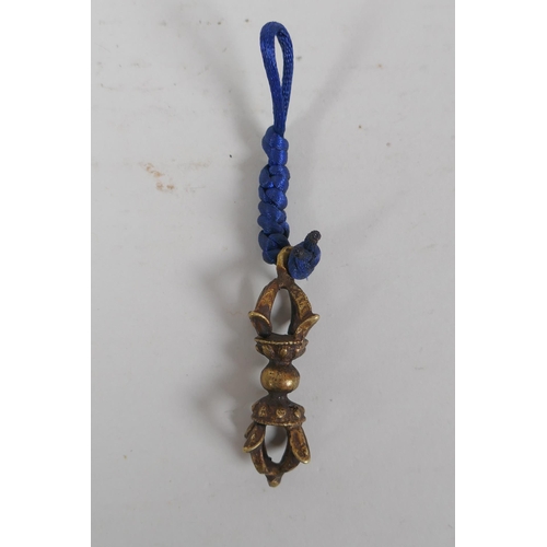 198 - A small Tibetan bronze double vajra pendant and a similar sized vajra pendant, 6 x 6cm