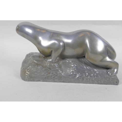 199 - A cold cast metal figure of an otter, signed, 27cm long