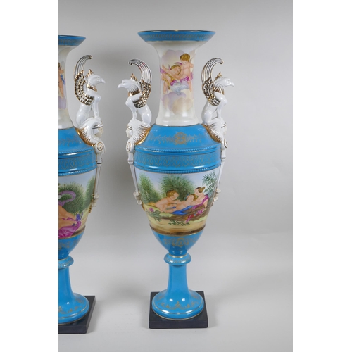 200 - A pair of Sevres style continental porcelain urns with griffin handles and putti decoration, 62cm hi... 