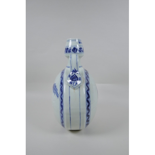 203 - A Chinese blue and white porcelain garlic head shaped moon flask with two handles, decorated with bi... 