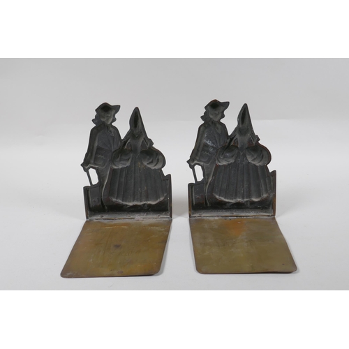 204 - A pair of antique cold painted bronze and brass book ends themed after the opera The Duenna, 16cm hi... 