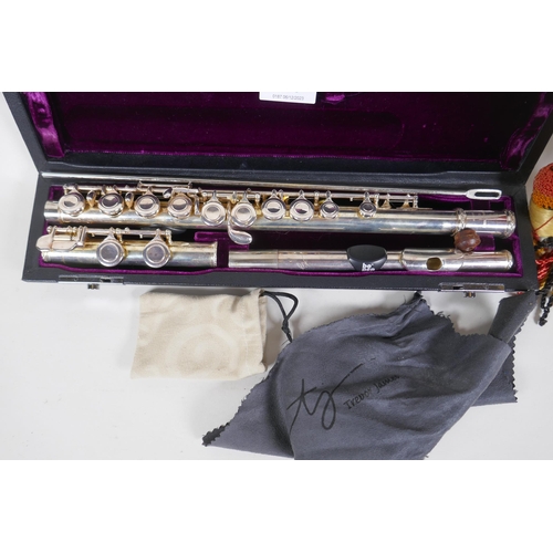 209 - Trevor James, 10 x E silver plated flute, No 66148, in case, and a vintage brass bugle, 30cm long