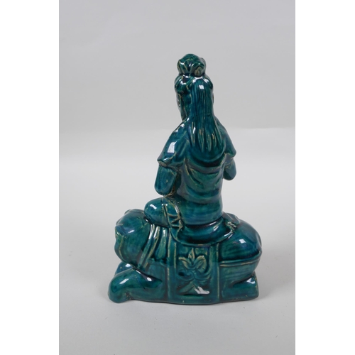 210 - A Chinese teal glazed porcelain Guan Yin, mark to base, 21cm high