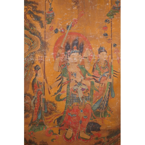 211 - A Tibetan printed thangka with a silk mount, 110 x 65cm