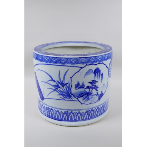 213 - A Chinese blue and white porcelain cylinder jardiniere, with landscape and floral decoration, 26cm h... 