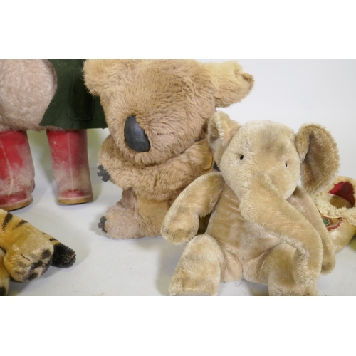 218 - A vintage Paddington Bear, a plush elephant, seal, tiger, leopard, real fur Koala bear in a pair of ... 